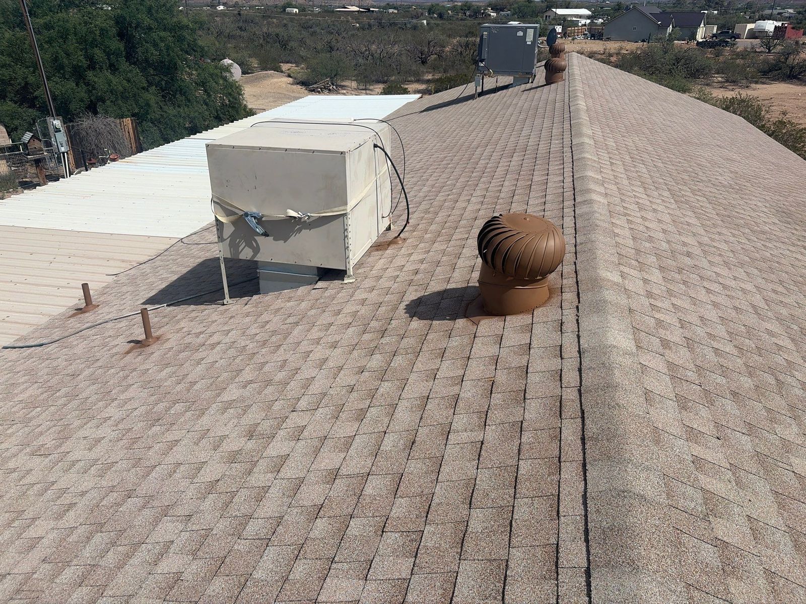 Tan and beige architectural shingle roof plane on a home in Safford, Arizona